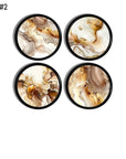 Four abstract marble cabinet knobs and drawer pulls with brown, beige, white, and gold fluid swirl patterns on a black base, designed for neutral, minimalist, warm contemporary, earthy boho, and nature‑inspired décor.
