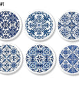 Navy blue floral Talavera designs on 6 white cabinet knobs. Azulejos art inspired furniture drawer pull hardware.