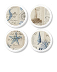 4 handmade coastal style drawer pulls. Beachy post card collage of lighthouse, starfish, seahorse, ship wheel, coral and seashell.