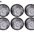 Modern contemporary cabinet door knobs in a white flower on gray damask. Decorative floral theme on black handle.