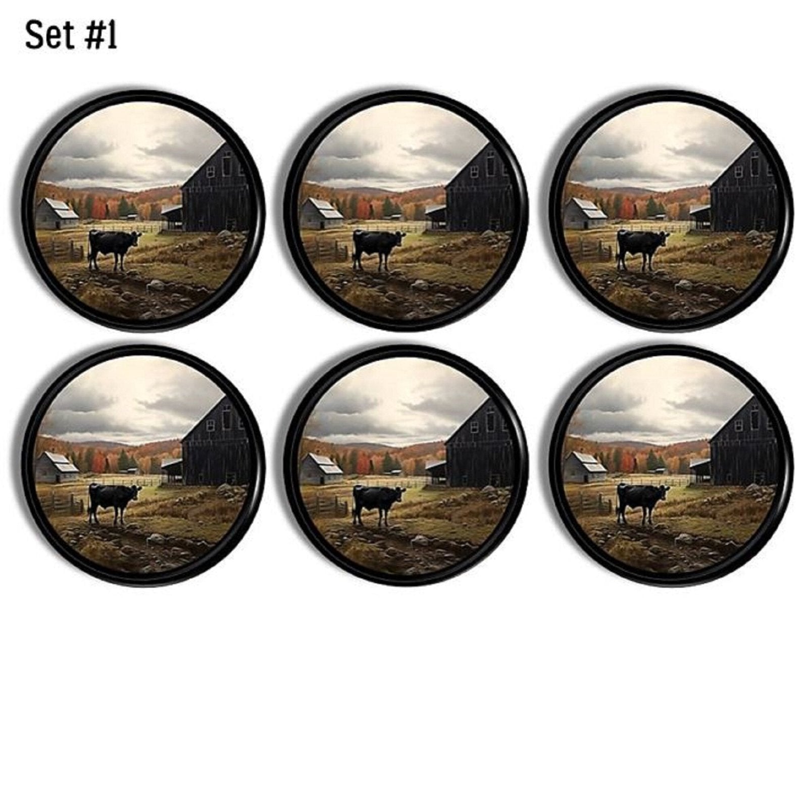 Decorative cabinet knobs made in a fall country theme. Drawer pulls featuring a black cow grazing next to an old barn surrounded in red, yellow and orange fall foliage.