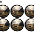 Decorative cabinet knobs made in a fall country theme. Drawer pulls featuring a black cow grazing next to an old barn surrounded in red, yellow and orange fall foliage.