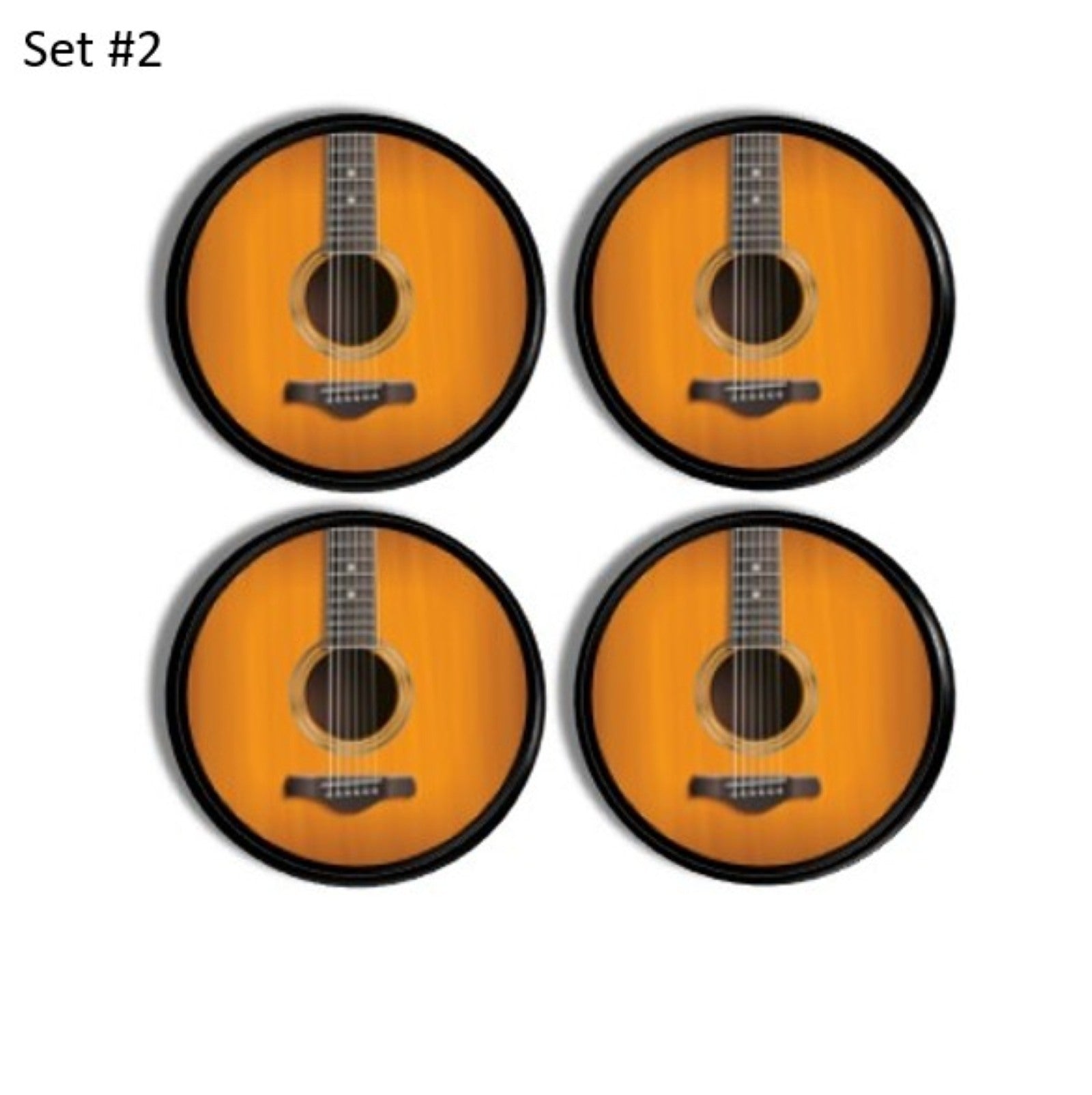 4 black cabinet knobs with a picture of acoustic guitar strings. Music inspired hardware on a round black handle.