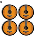 4 black cabinet knobs with a picture of acoustic guitar strings. Music inspired hardware on a round black handle.
