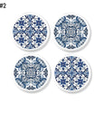 Four handmade cabinet knobs in a navy blue and white Azulejos art design. Spanish tile look drawer pulls.