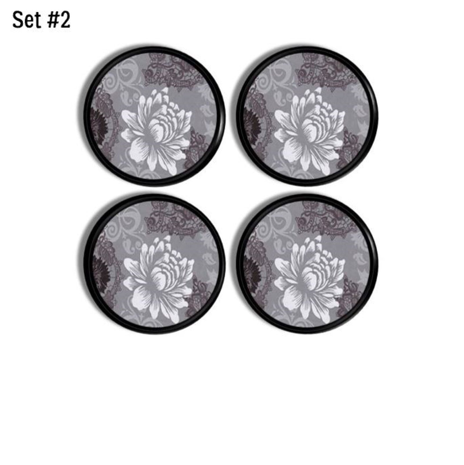 Four round decorative drawer pulls featuring white flower stencil on gray damask. Modern Farmhouse style hardware.