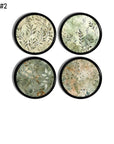 Four moody modern cabinet knobs with soft watercolor foliage in sage and beige layered over a deep black base