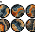 Set of 6 handmade cabinet knobs decorated in an abstract wave pattern. Orange, navy and tan design on black drawer pull.
