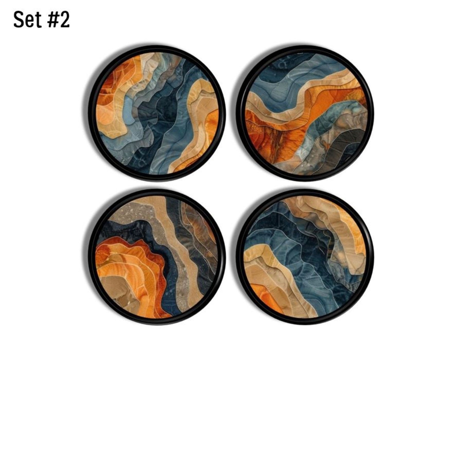 Four furniture drawer pulls in a funky navy blue and terracotta orange abstract design. Artsy design on black knob.