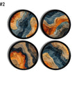 Four furniture drawer pulls in a funky navy blue and terracotta orange abstract design. Artsy design on black knob.