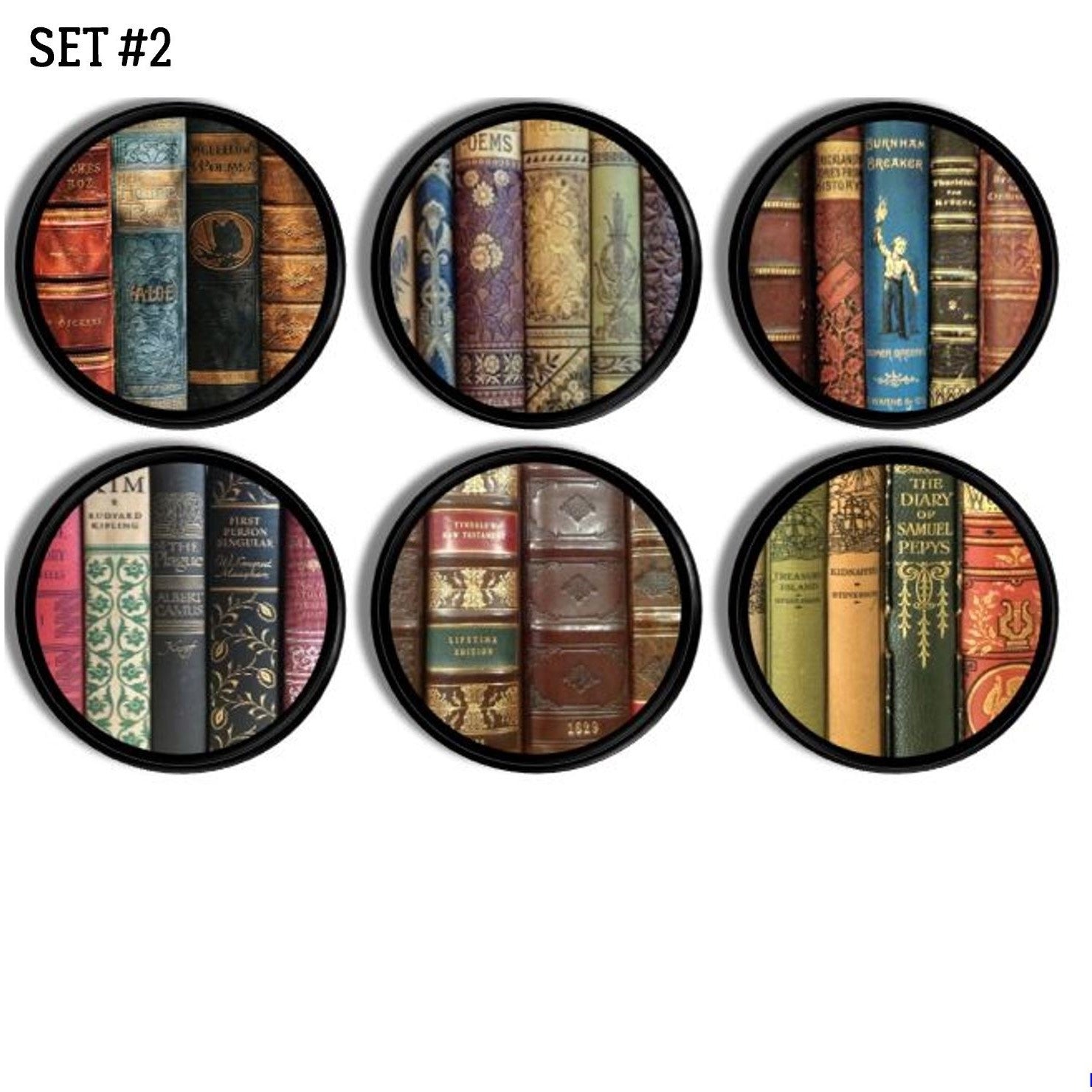 A set of vintage style cabinet knobs or drawer pulls, featuring an illustration of old, bound books in a circular black frame design.