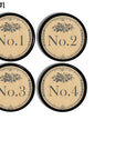 Four handmade cabinet knobs decorated in numbers 1 through 4. The design is inspired by vintage French hotel door plate with an antique font and subtle gray floral accents on an antique beige background.