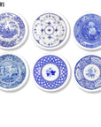 Set of six blue and white Delft‑style cabinet knobs and drawer pulls featuring vintage transferware plate designs with pastoral scenes, chinoiserie florals, geometric borders, and classic toile artwork.