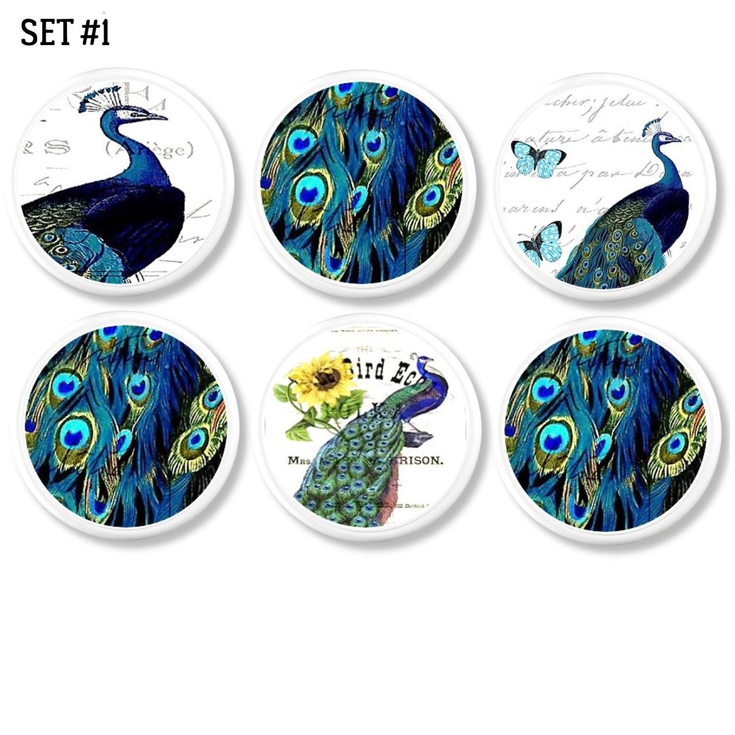 6 Decorative white knobs with bright blue peacock on white background with butterfly and sunflower accents.