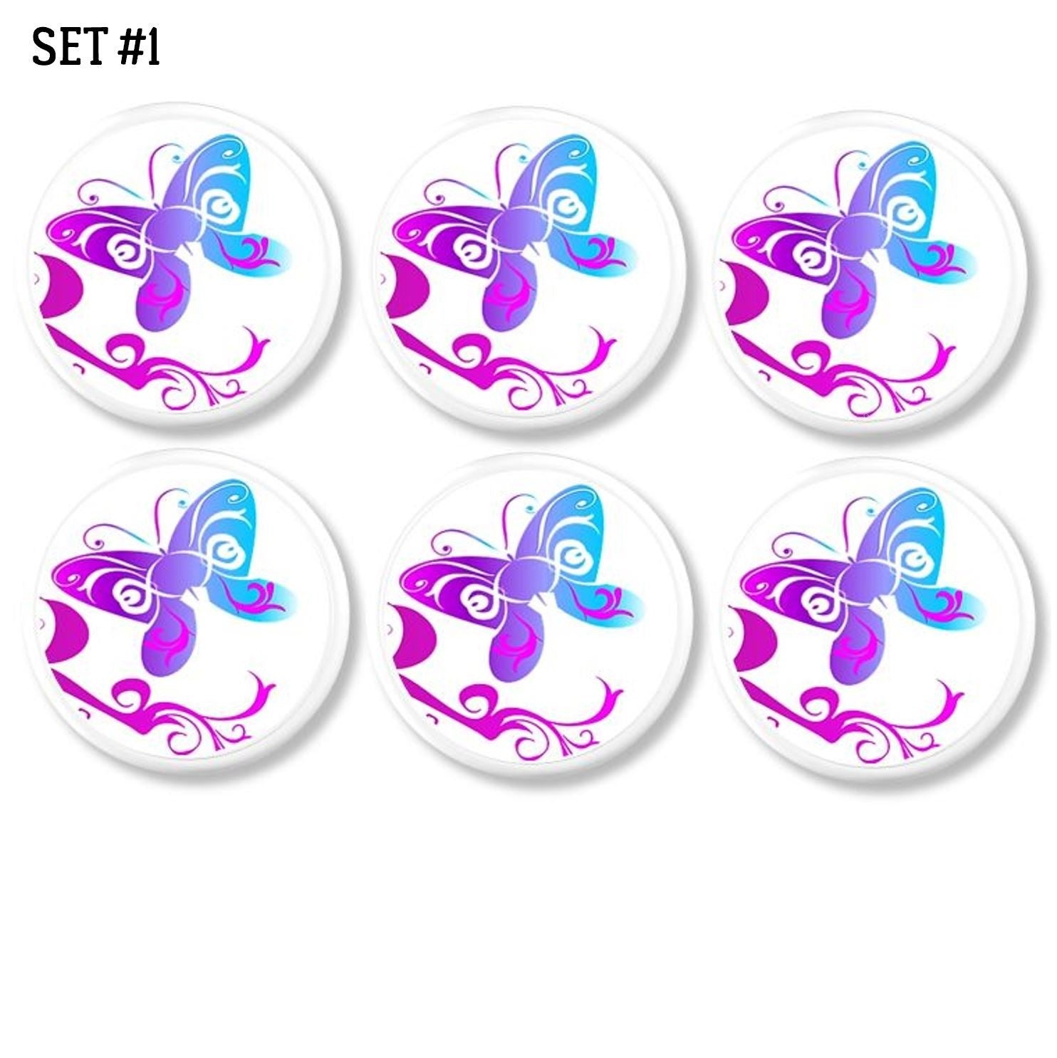6 Tattoo style butterfly design dresser drawer pulls in vibrant fuchsia, blue and purple on white knobs. Cabinet knobs for a young girl's bedroom or bathroom update.