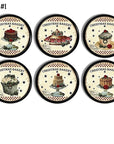6 Baking themed decorative kitchen cabinet knobs. Christmas holiday cupcakes, cakes and pies in an antique primitive style on a black drawer pull.