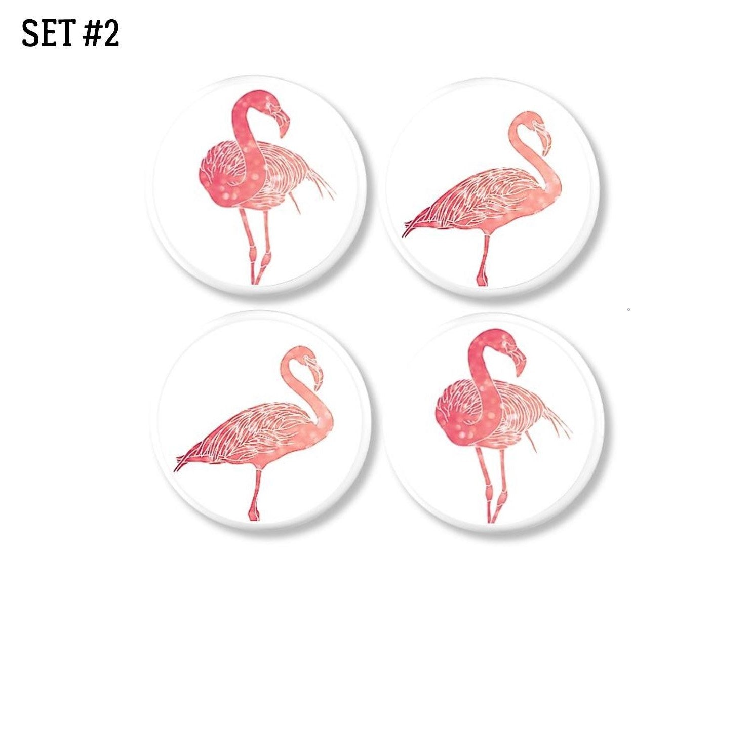 4 Piece decorative drawer pull set in a simple flamingo bird theme. Knobs in shades of coral and salmon on white for a minimalist tropical decor update.