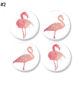 4 Piece decorative drawer pull set in a simple flamingo bird theme. Knobs in shades of coral and salmon on white for a minimalist tropical decor update.