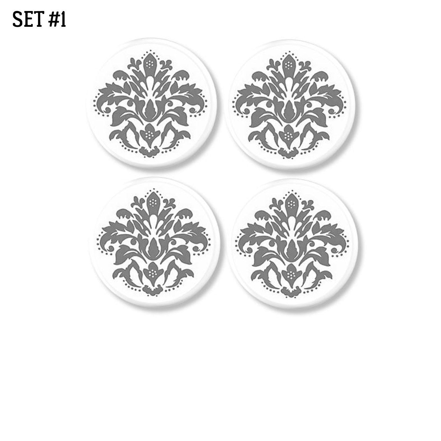 4 Handmade decorative dresser drawer knobs with medium gray floral damask on white drawer pull.