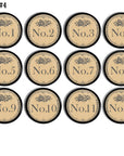 12 handmade round drawer pulls decorated in antique door plate style numbers with a French Quarters feel. Design colors are gray and background is beige. Knob base is black.