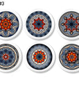 Six handcrafted cabinet knobs featuring quilt-inspired mandala designs in vibrant blue, red, and orange tones — each with a unique symmetrical pattern and artisan flair. Perfect for expressive drawer pulls in Boho, Indie, or Cottagecore interiors.
