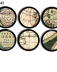 Six old‑world map cabinet knobs on a black base, featuring detailed cartographic lines, regional labels, and globe fragments that add a refined explorer’s aesthetic to desks, cabinets, or study furniture.