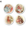 4 cabinet door knob handles in Peter Rabbit story illustrations. White drawer pull hardware for Beatrix Potter baby nursery decor..