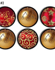 Six‑piece red and gold holiday ornament handmade cabinet knob set featuring elegant filigree patterns, swirling metallic motifs, leaf accents, and star details for upscale Christmas décor hardware
