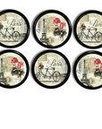 Custom made cabinet and door knobs with antiqued eiffel tower, bicycle and floral. Elegant drawer handles for dresser DIY.