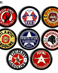Set of 8 cabinet knobs decorated in vintage gas & oil can labels for workshop, garage, masculine gear head bathroom.