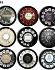 Nine assorted vintage telephone dial cabinet knobs featuring mixed‑era graphics, operator labels, and long‑distance themes, ideal for steampunk and bold statement industrial furniture accents.