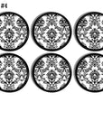Sexy steampunk Victorian bathroom cabinet drawer pulls in black and white wallpaper print.
