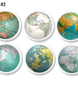 Six handcrafted cabinet knobs featuring vintage globe segments in varied cartographic styles — showcasing continents and oceans from around the world on a clean white base. A smart choice for classroom drawers, study cabinets, or geography-themed office décor