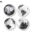 Four handcrafted cabinet knobs featuring stylized black-and-white world map views — highlighting major continents and oceans on a clean white knob base. A smart accent for classroom drawers, study cabinets, or geography-themed furniture.