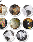 Eight handcrafted cabinet knobs showcasing diverse globe illustrations in vintage and modern map styles — mounted on a white base knob for a clean, contemporary feel. A versatile choice for geography-themed drawers, classroom furniture, or minimalist travel décor.