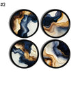 Four abstract marble cabinet knobs with blue, beige, white, and brown fluid swirl patterns on a black base, designed for minimalist, neutral, modern rustic, transitional, and contemporary décor.