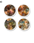 A four‑piece abstract floral cabinet knob set featuring defined petal‑like shapes, fine vein detailing, and warm botanical tones. Each knob highlights expressive floral forms with richer contrast and more structured ink patterns, creating an artistic modern boho look ideal for dressers, cabinets, and eclectic home décor.