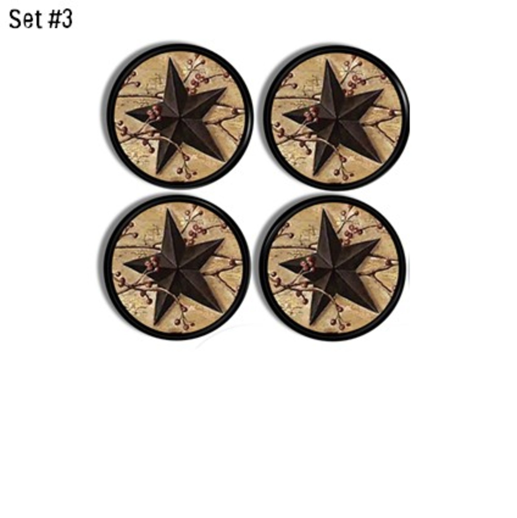 Set of four cabinet knobs featuring black five-point stars with red berry branches on aged parchment backgrounds.