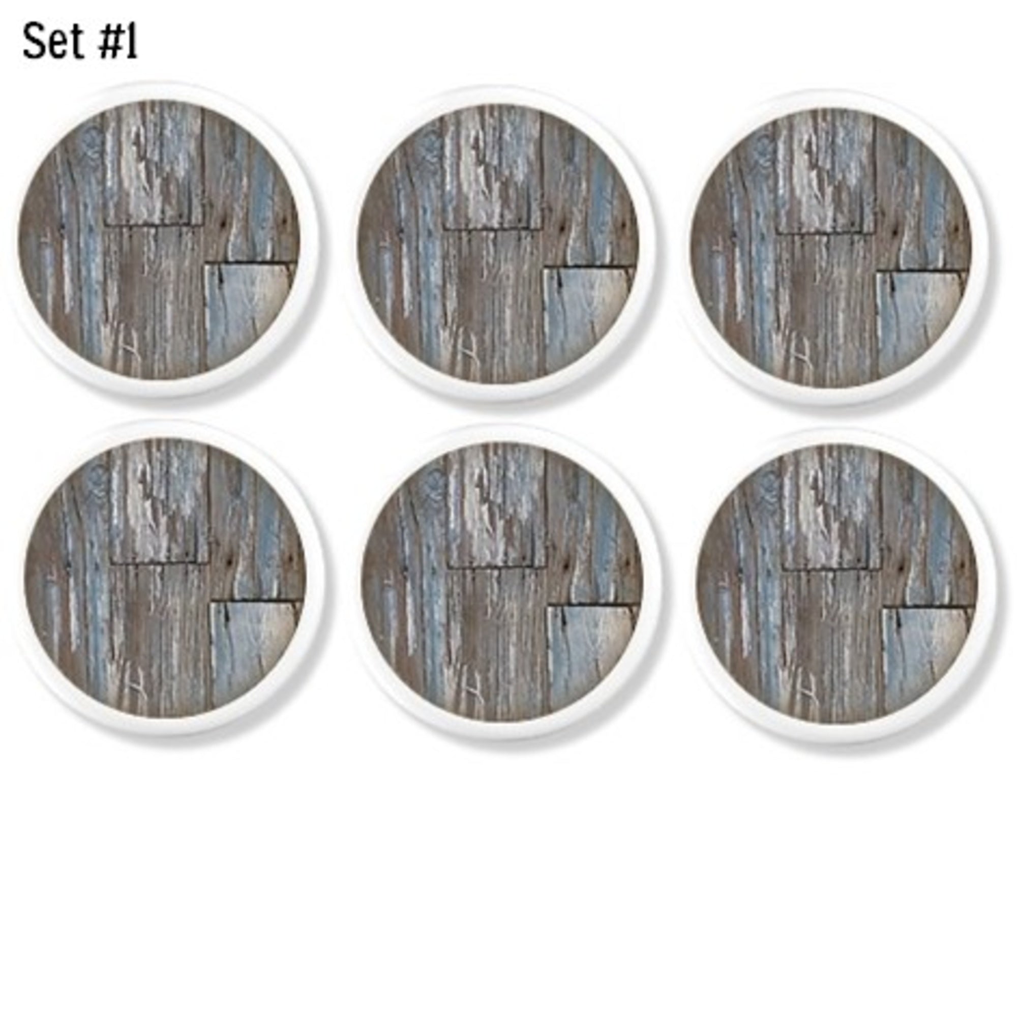Handmade cabinet knob set featuring distressed weathered wood graphics in soft gray and faded blue tones.