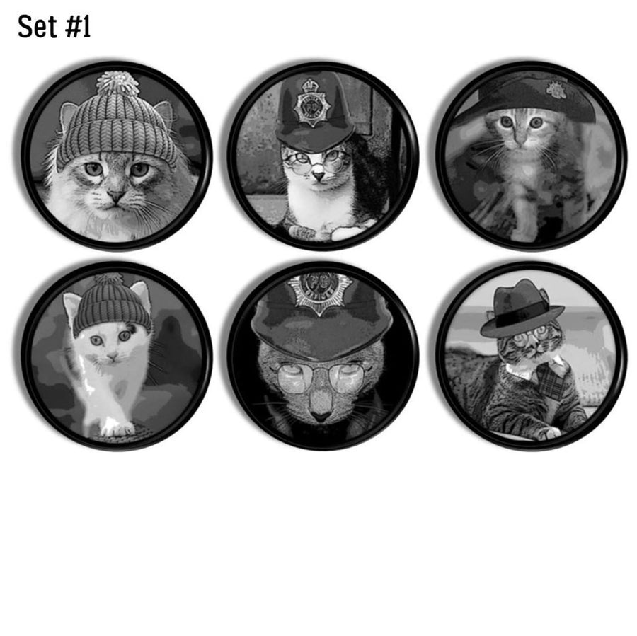 6 handmade decorative cabinet knob hardware in a whimsical cat theme on black drawer pulls.