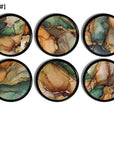 Six handcrafted cabinet knobs featuring earthy marbled mineral patterns in warm greens, rust, beige, and soft neutrals, with organic agate‑style swirls and natural stone‑inspired veining — ideal for boho, earthy modern, or nature‑inspired furniture accents.