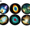 Black knobs featuring colorful nebula and star formation artwork. Includes red, green, blue, and yellow cosmic clouds with intricate space details. Set of six handcrafted drawer pulls for galaxy themed bedroom or mystical cabinet décor.