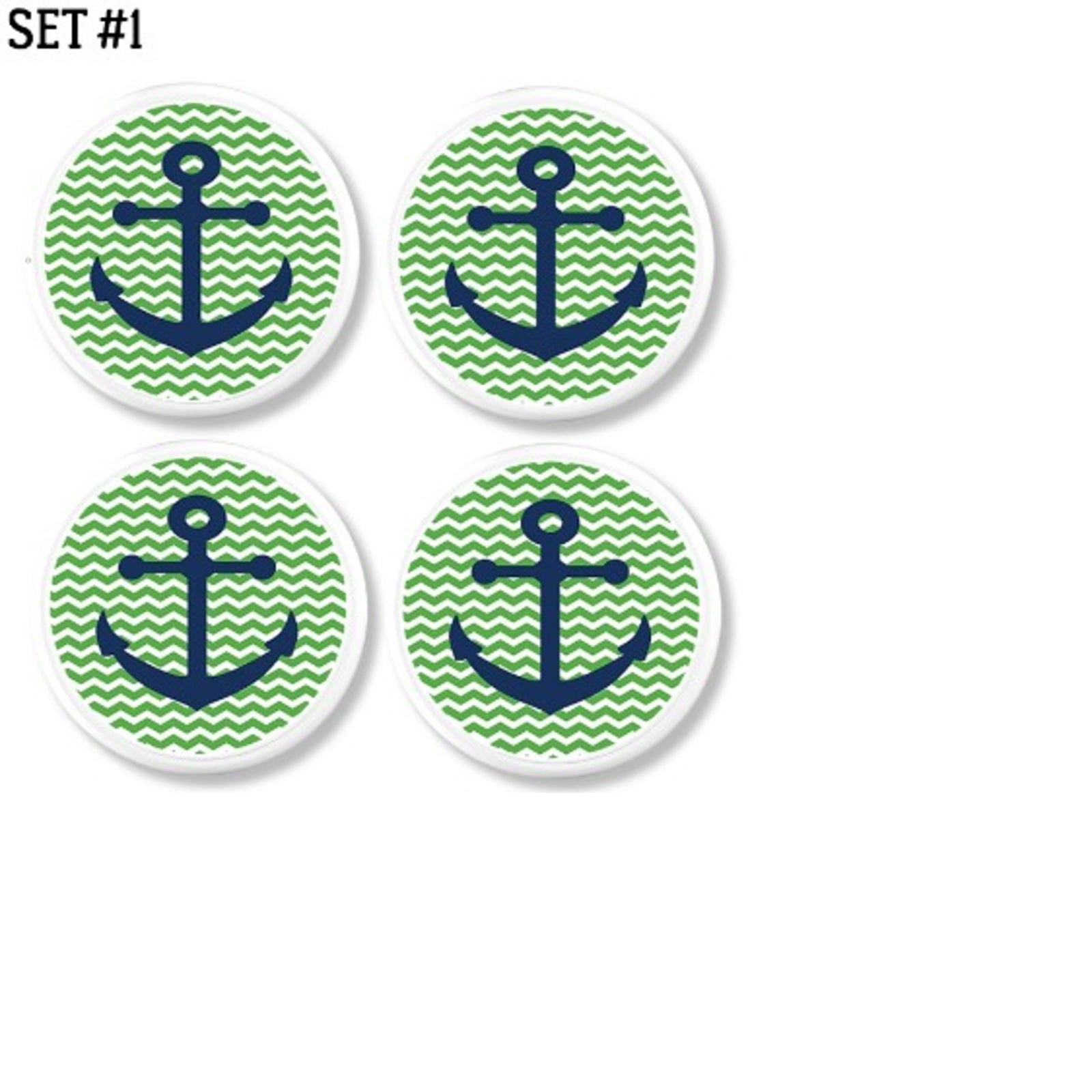Four decorative cabinet knobs with navy blue anchors on green and white chevron backgrounds. Classic nautical hardware for coastal laundry room, entryway furniture, a beachy cottage nursery.