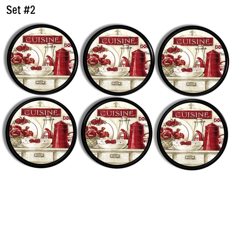 “Black cabinet knobs and drawer pulls in a 6-piece set featuring red and white country kitchen graphics with ‘CUISINE’ sign.”