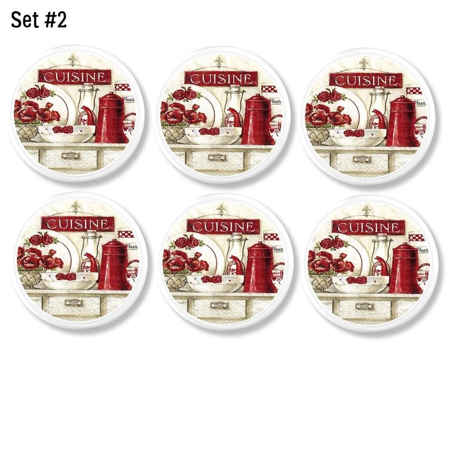 White cabinet knobs in a 6-piece set featuring red and white French country kitchen ‘CUISINE’ graphics with rustic countertop décor.
