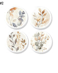 Four-piece neutral foliage cabinet knob decorative hardware set featuring watercolor botanical artwork in beige, taupe, sage, and soft gray tones on white knob bases, ideal for Japandi interiors, earthy modern furniture, calming bedroom decor, and nature-inspired dresser makeovers