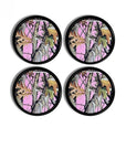 Four black cabinet knobs showcasing bold pink camo with tree bark and leaf textures for modern cabin or lodge décor.