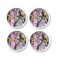 Four white cabinet knobs featuring pink camouflage with oak leaves and woodland branches for rustic country décor.