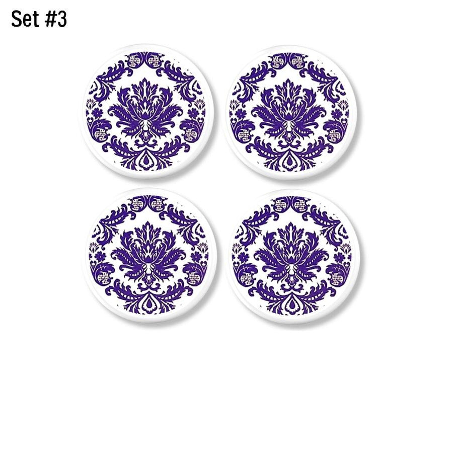 Four piece set of decorative door handles. Purple and white damask for a modern vintage chic furniture accent with unique handle hardware.
