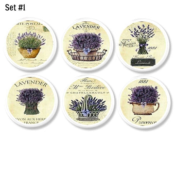 Decorative cabinet knobs in a garden lavender theme featuring rustic baskets and French script on a white base. Ideal handles for a shabby chic bathroom.